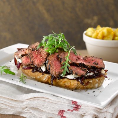 SLICED STEAK WITH CARAMELISED RED ONIONS